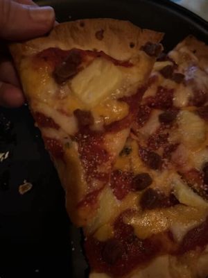 Who was the musical guest on SNL, and why do pineapples belong on pizza?